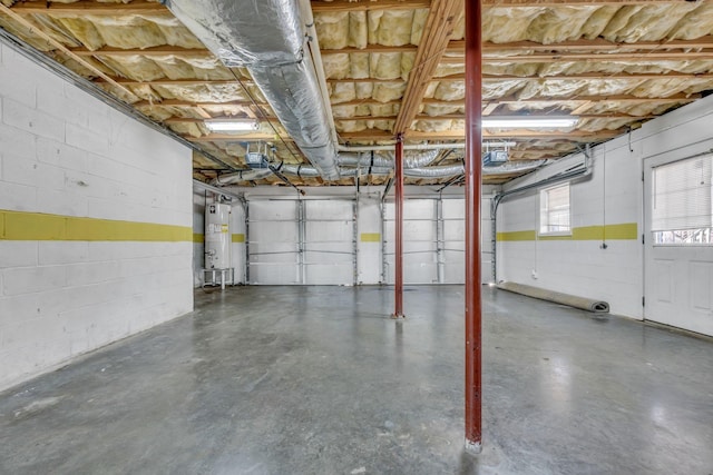 garage featuring water heater and a garage door opener