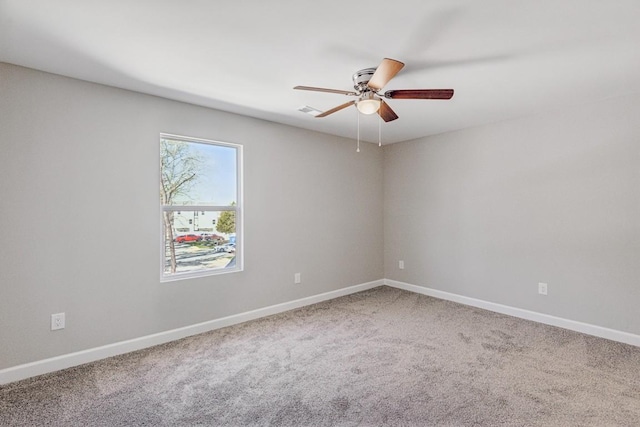 spare room with carpet flooring and ceiling fan