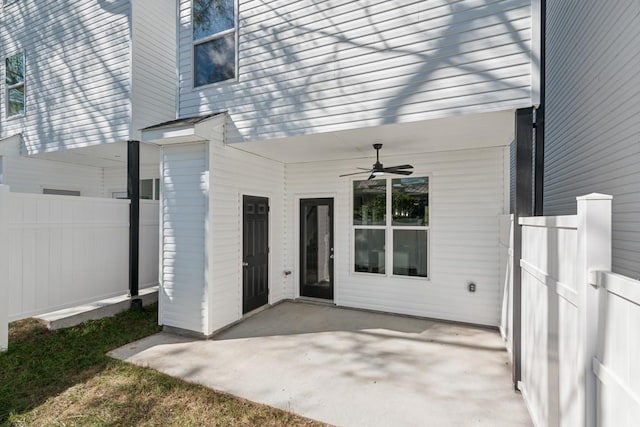 property entrance featuring ceiling fan and a patio