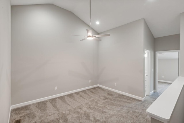 unfurnished room with lofted ceiling, light carpet, and ceiling fan