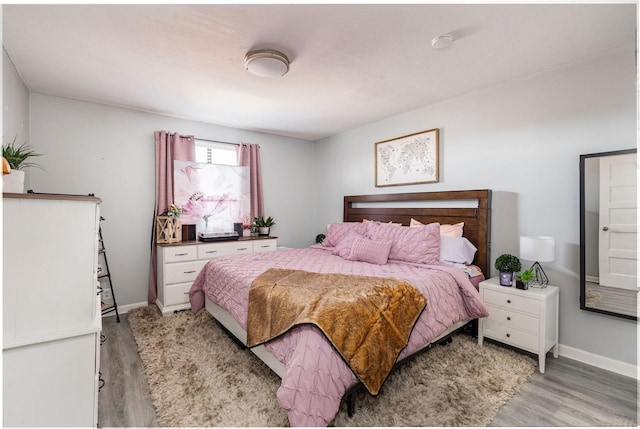 bedroom with light wood-type flooring