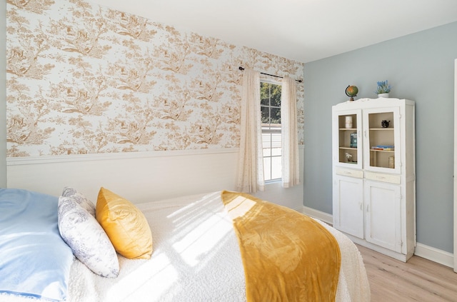 bedroom with light hardwood / wood-style floors