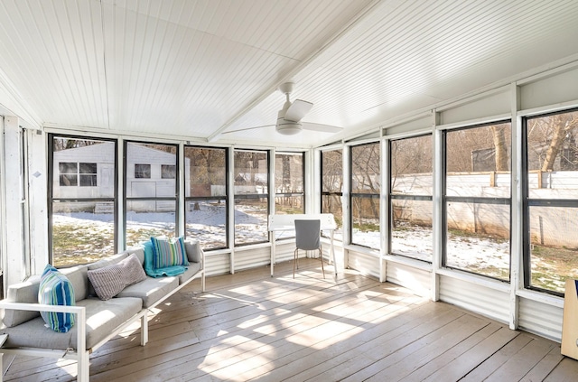 unfurnished sunroom featuring ceiling fan and lofted ceiling