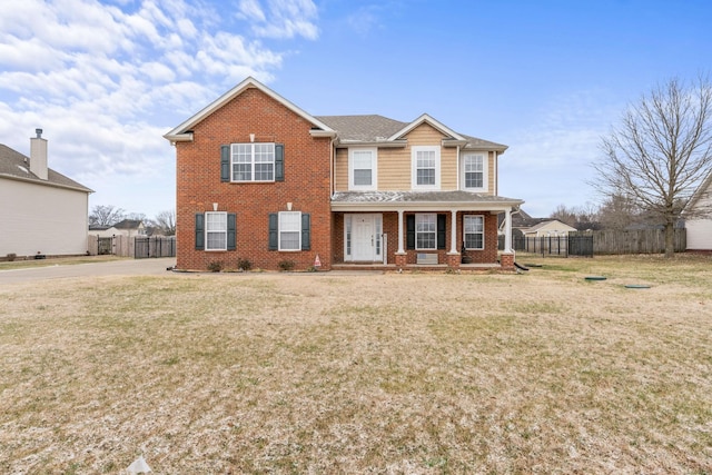 view of front of house with a front lawn and covered porch