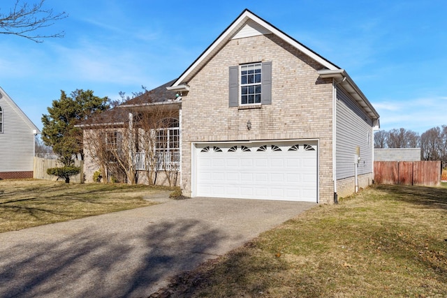 view of front property with a front lawn and a garage