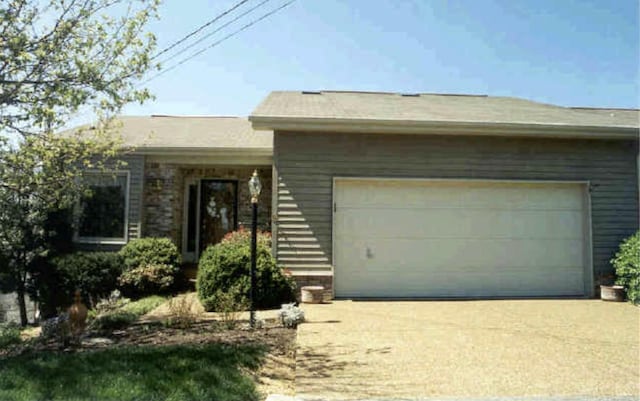 ranch-style home with a garage