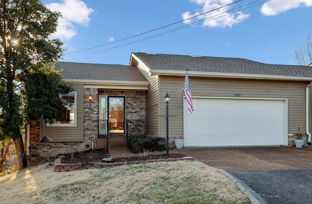 ranch-style house featuring a garage