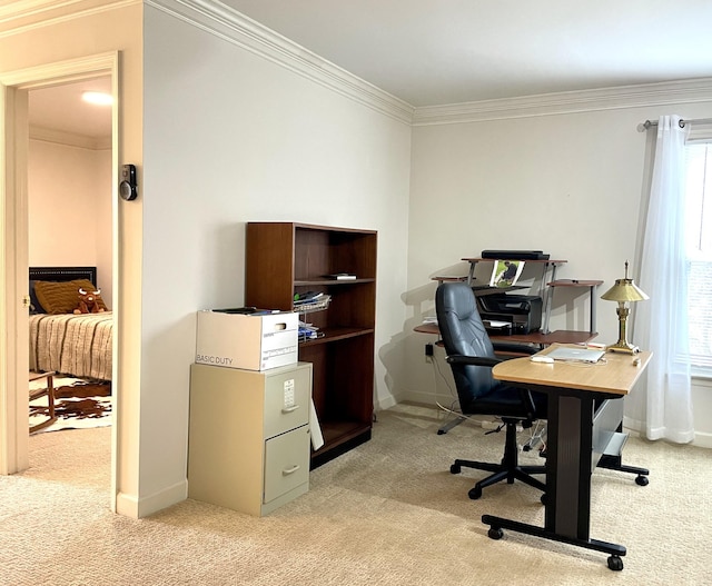 home office with crown molding, light colored carpet, and a healthy amount of sunlight