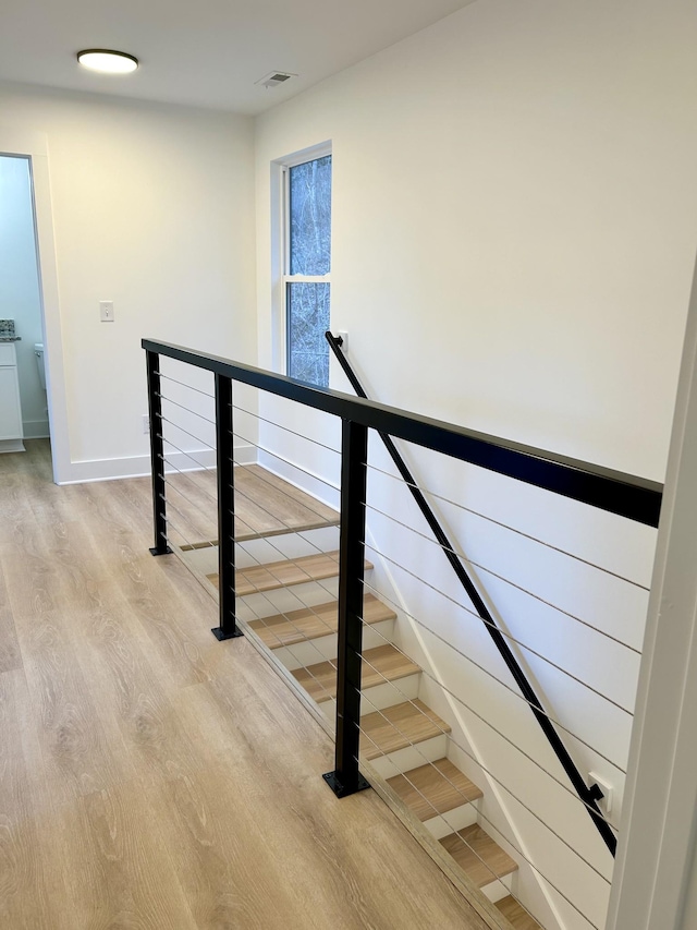 stairway with wood-type flooring