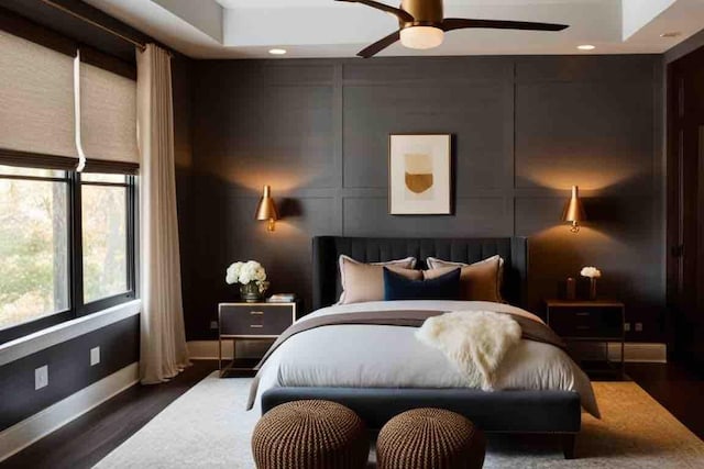 bedroom with ceiling fan and dark hardwood / wood-style flooring