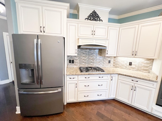 kitchen featuring custom exhaust hood, stainless steel appliances, light stone countertops, decorative backsplash, and white cabinets