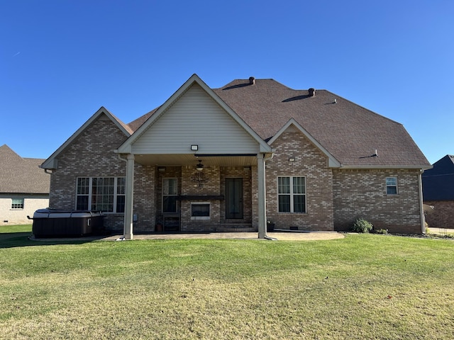 rear view of house featuring a patio area, ceiling fan, and a yard