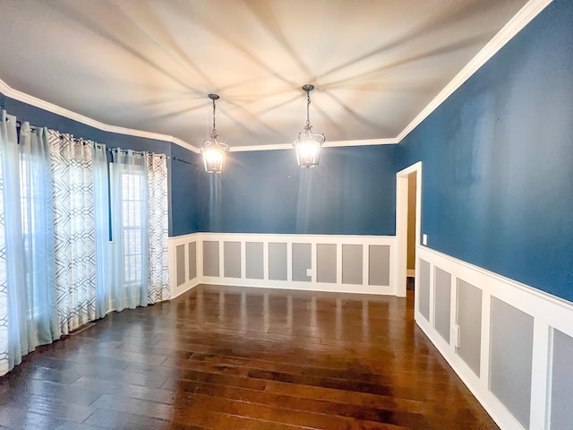 empty room featuring ornamental molding and dark wood-type flooring