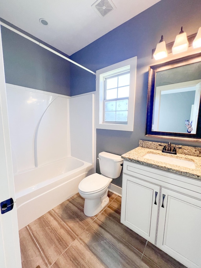 full bathroom with toilet, vanity, shower / tub combination, and hardwood / wood-style floors