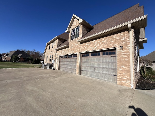 view of property exterior with a garage