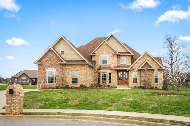 craftsman inspired home featuring french doors and a front yard