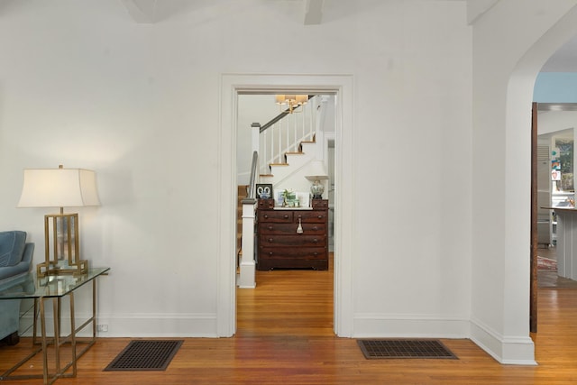 corridor featuring wood-type flooring