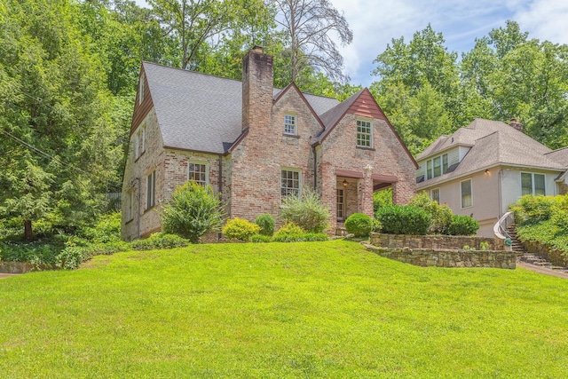 tudor house with a front yard