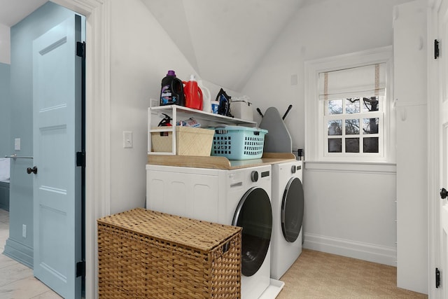 washroom featuring washing machine and clothes dryer