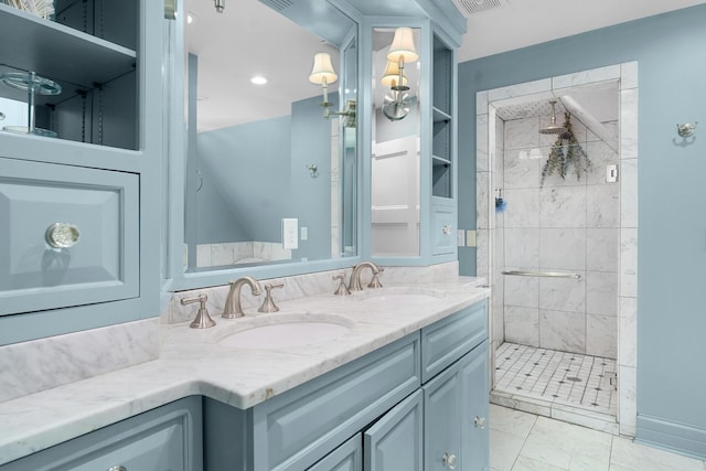 bathroom featuring built in shelves, vanity, and a tile shower