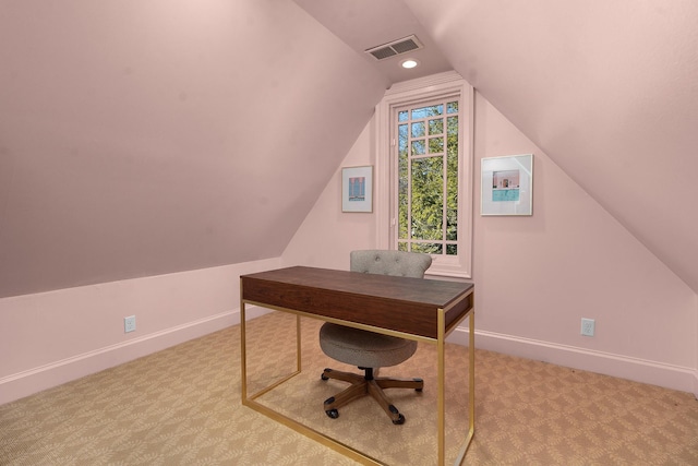 carpeted office space featuring lofted ceiling