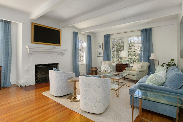 living room featuring hardwood / wood-style floors and beam ceiling