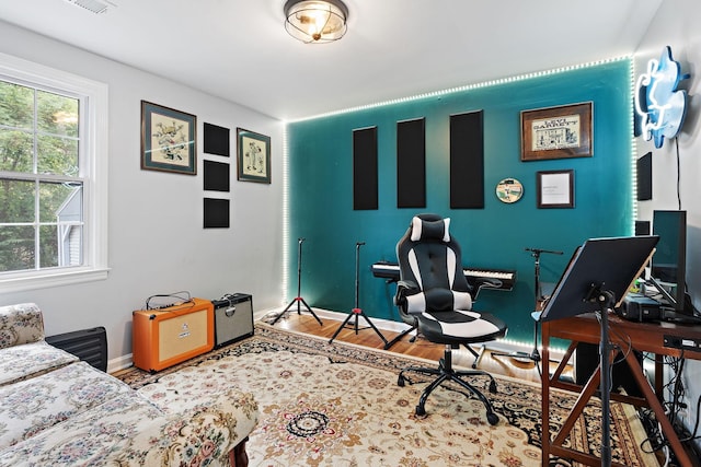 home office with hardwood / wood-style floors and plenty of natural light