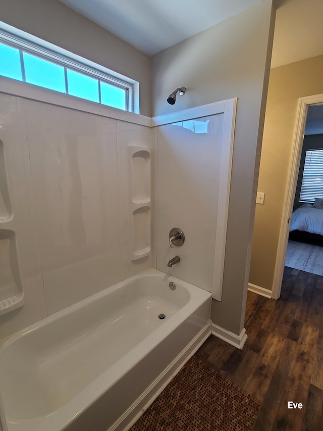 bathroom with shower / tub combination and wood-type flooring