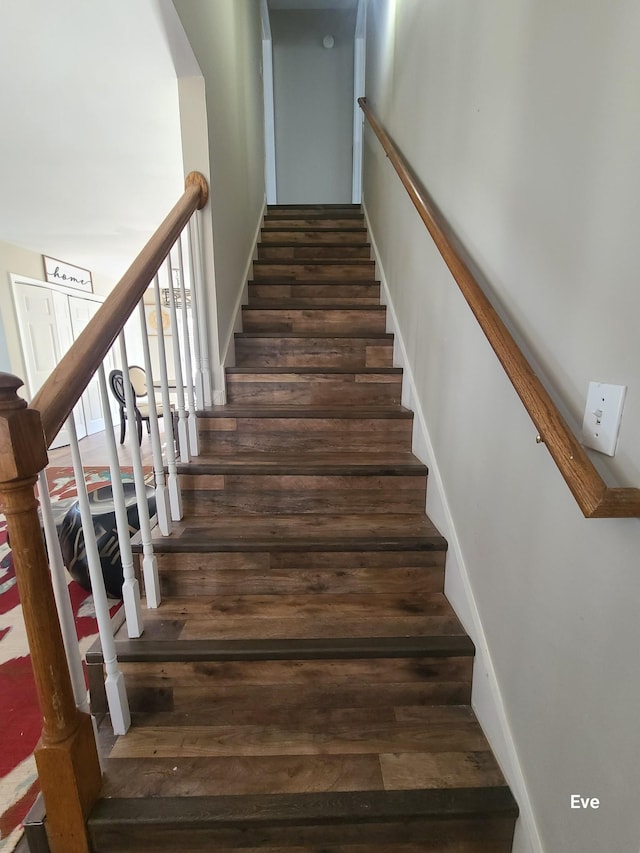 stairway featuring hardwood / wood-style flooring