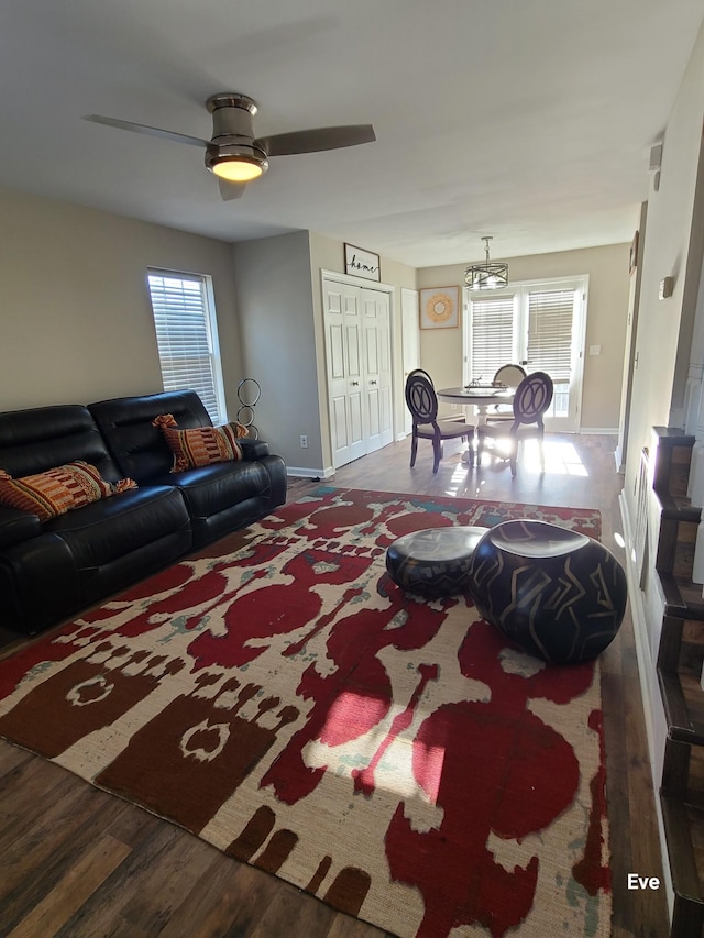 living room featuring ceiling fan and wood-type flooring