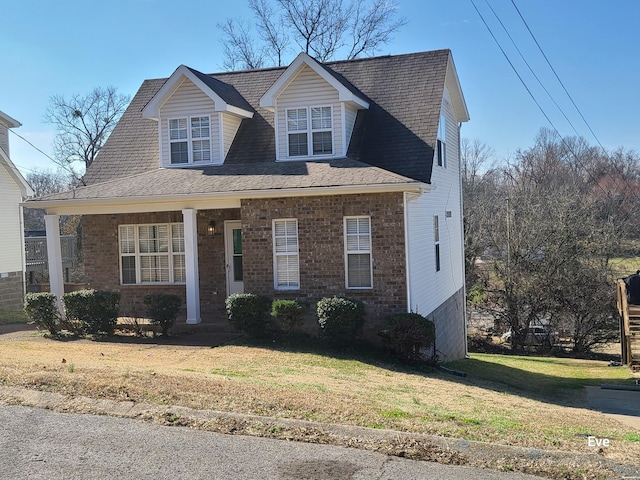 view of front of property with a porch and a front yard