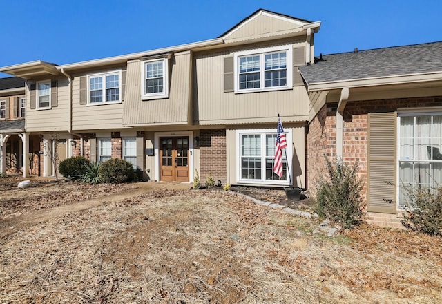 townhome / multi-family property featuring french doors