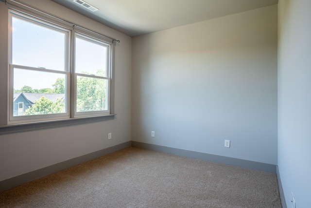 empty room featuring carpet flooring