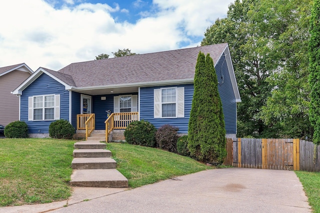 view of front of home with a front yard and covered porch