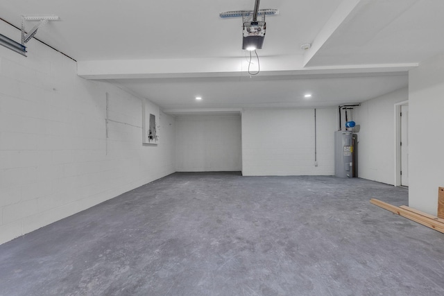 garage with a garage door opener and water heater