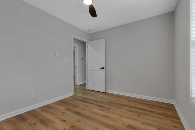 unfurnished room featuring ceiling fan and light hardwood / wood-style floors