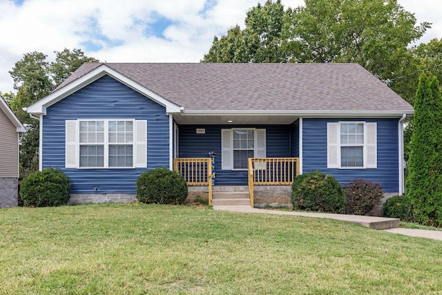 view of front of property with a porch and a front lawn