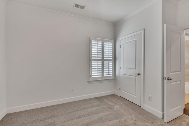 unfurnished bedroom featuring ornamental molding and light carpet