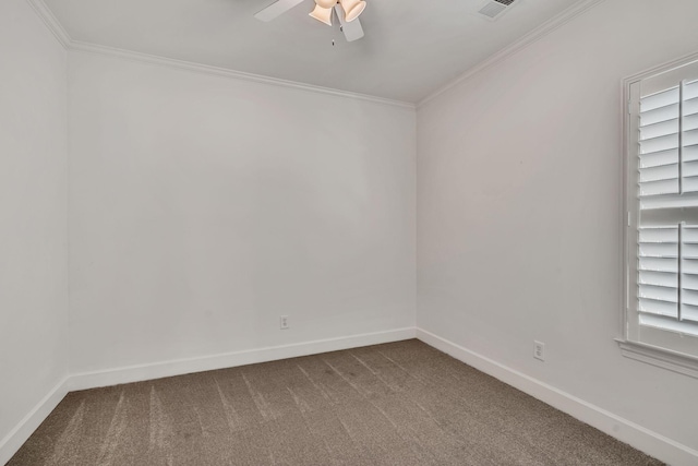 carpeted spare room with ceiling fan and ornamental molding