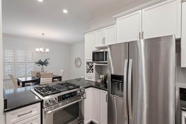 kitchen featuring white cabinetry, a chandelier, pendant lighting, crown molding, and appliances with stainless steel finishes