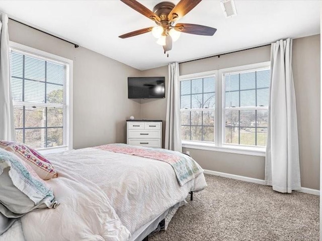 carpeted bedroom with ceiling fan