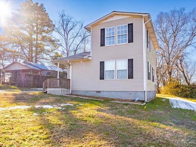 exterior space with a yard and a wooden deck