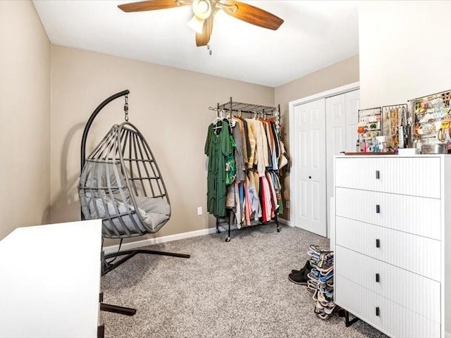 walk in closet featuring ceiling fan and carpet floors