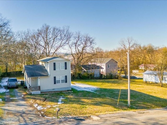 view of front of home with a front lawn