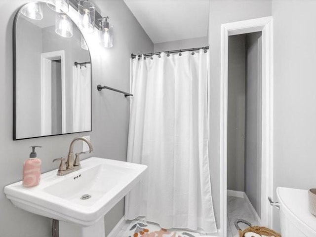 bathroom featuring toilet and sink