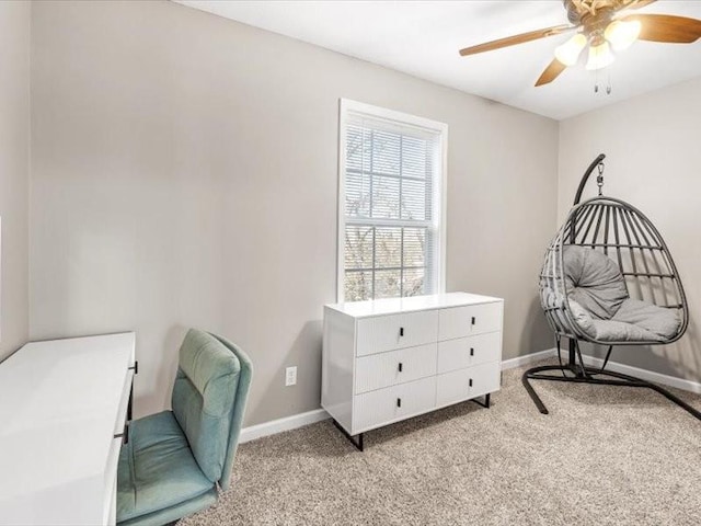 sitting room featuring light carpet and ceiling fan