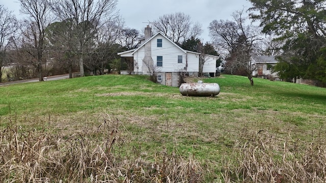 view of property exterior with a yard