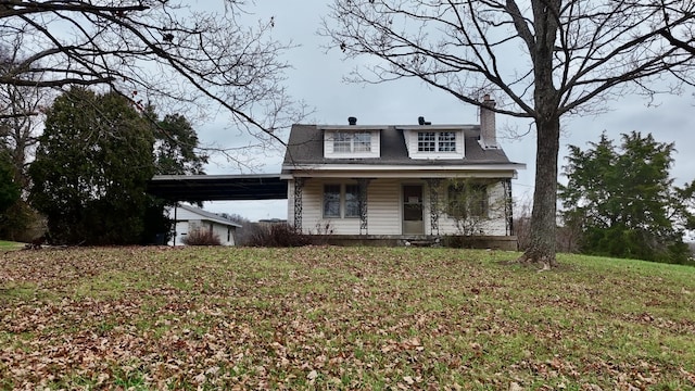 view of front of house featuring covered porch and a front yard