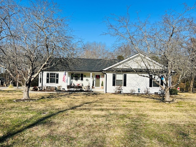 single story home featuring a front lawn