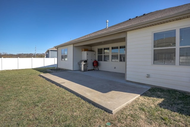 exterior space with a patio area and a lawn